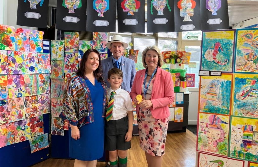 (L-R) Jadie Patricia Oberholzer with her son Cornelius, Councillor Nigel Folkard and Anna Firth MP at St Pierre School