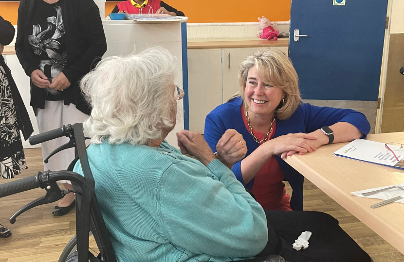Anna Firth MP speaking to a resident at St Martins